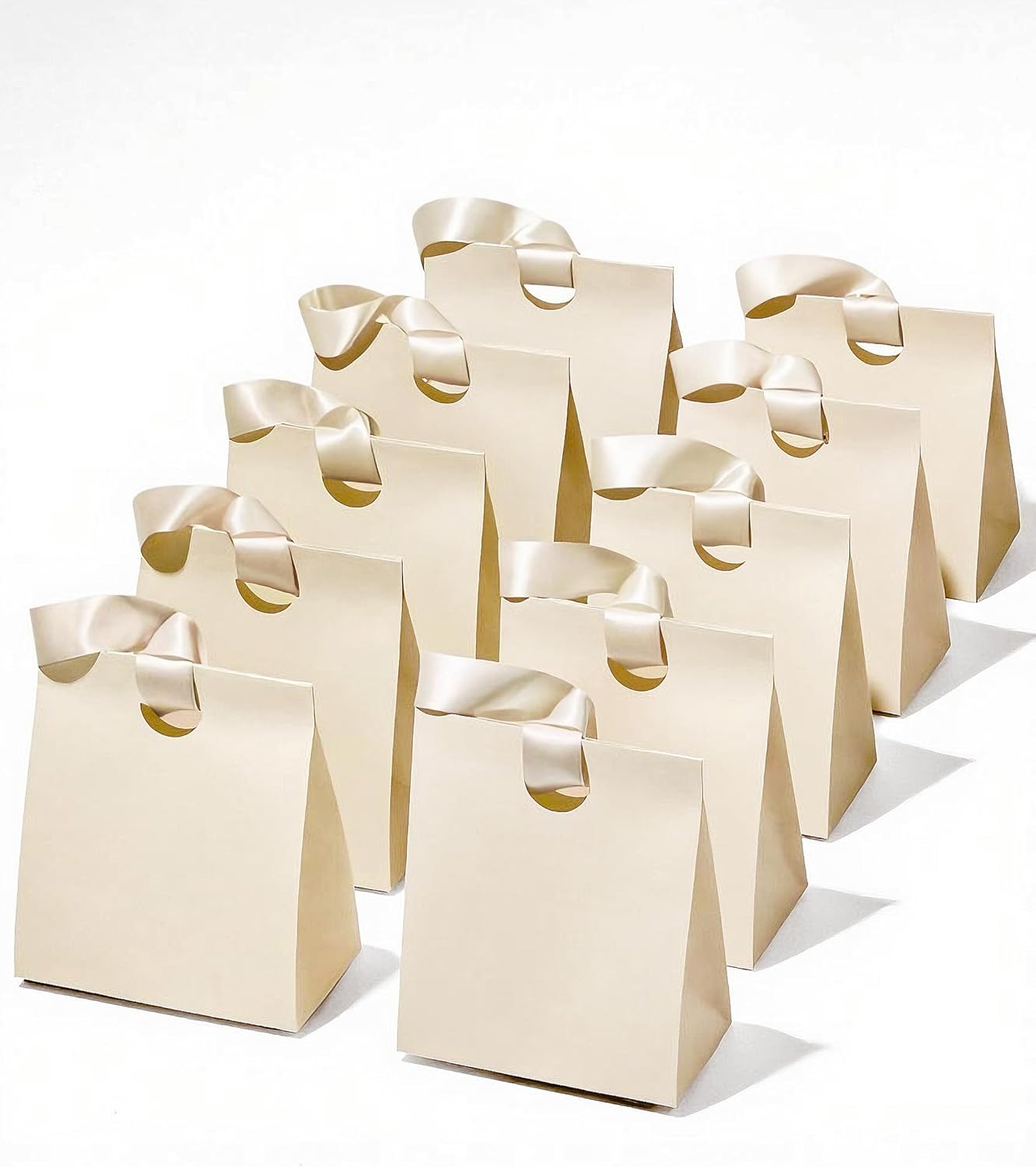 Set of small cream white paper gift bags with ribbon handles