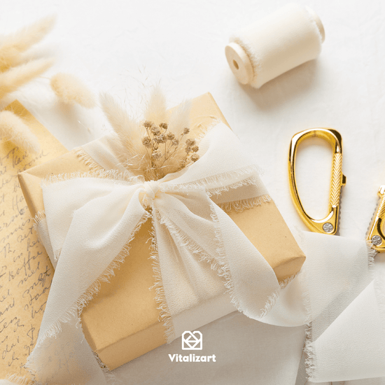 Cream-white chiffon ribbon on a wooden spool