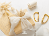 Cream-white chiffon ribbon on a wooden spool