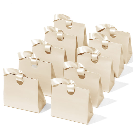 Mini cream-white paper gift bags with ribbon handles