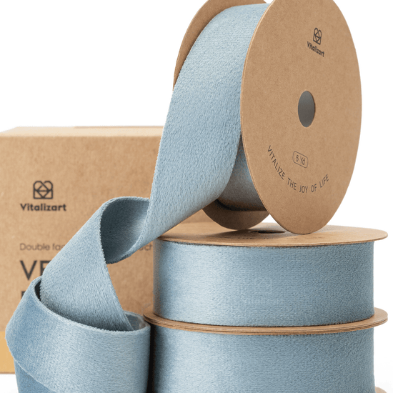 Dusty blue double-faced velvet ribbon on a spool