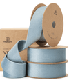 Dusty blue double-faced velvet ribbon on a spool