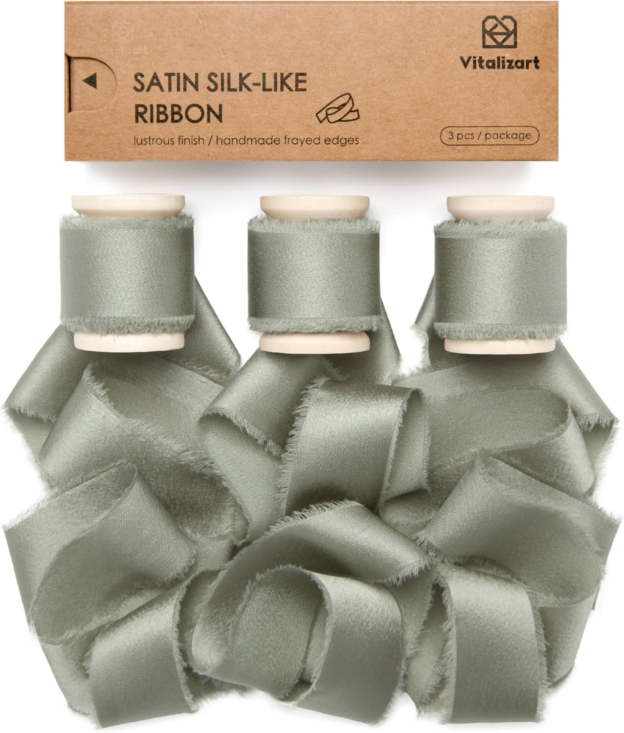 Dusty green silk satin ribbon on a wooden spool