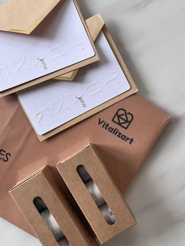 Embossed thank-you cards and Vitalizart ribbon packaging