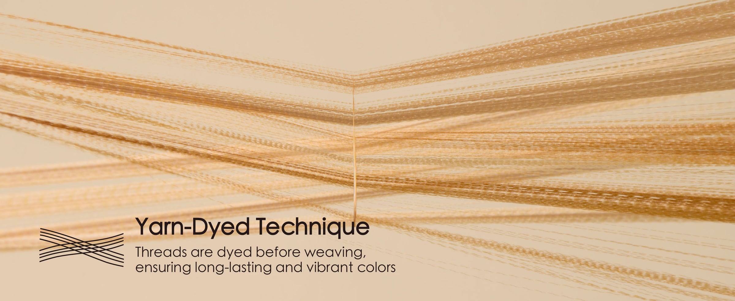 Macro view of fine gold satin ribbon threads fanning outward to show the yarn-dyed weave