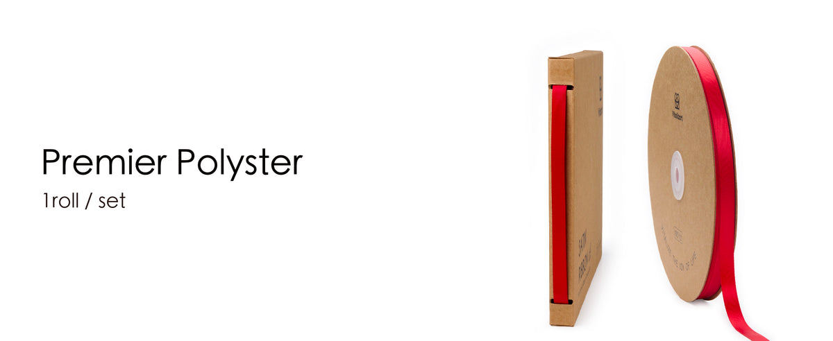 Red satin ribbon shown on a kraft spool and feeding through a matching dispenser box