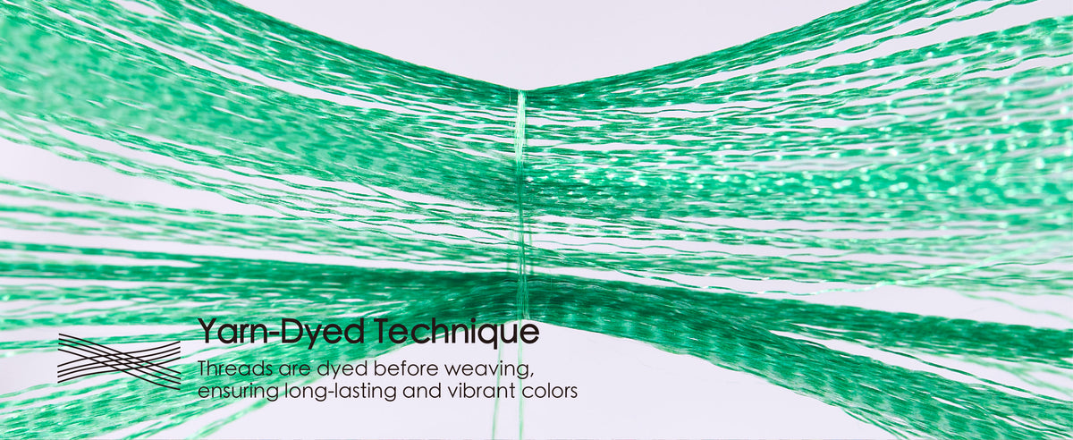 Green ribbon yarns spread apart to demonstrate the yarn-dyed construction before weaving