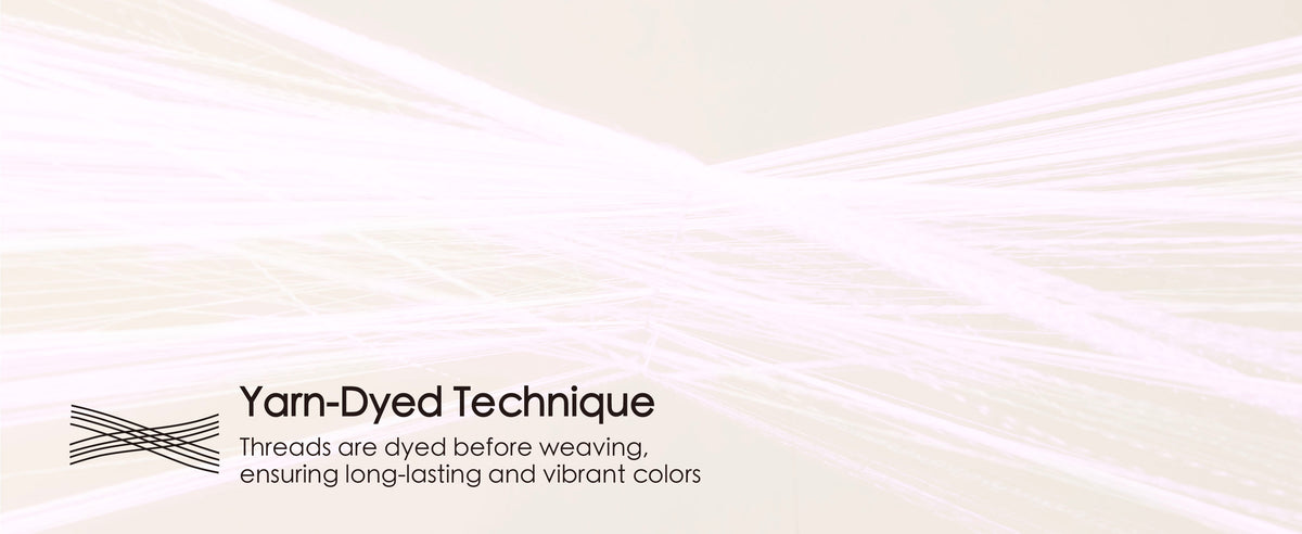 Magnified pale pink thread strands illustrating the ribbon's yarn-dyed construction