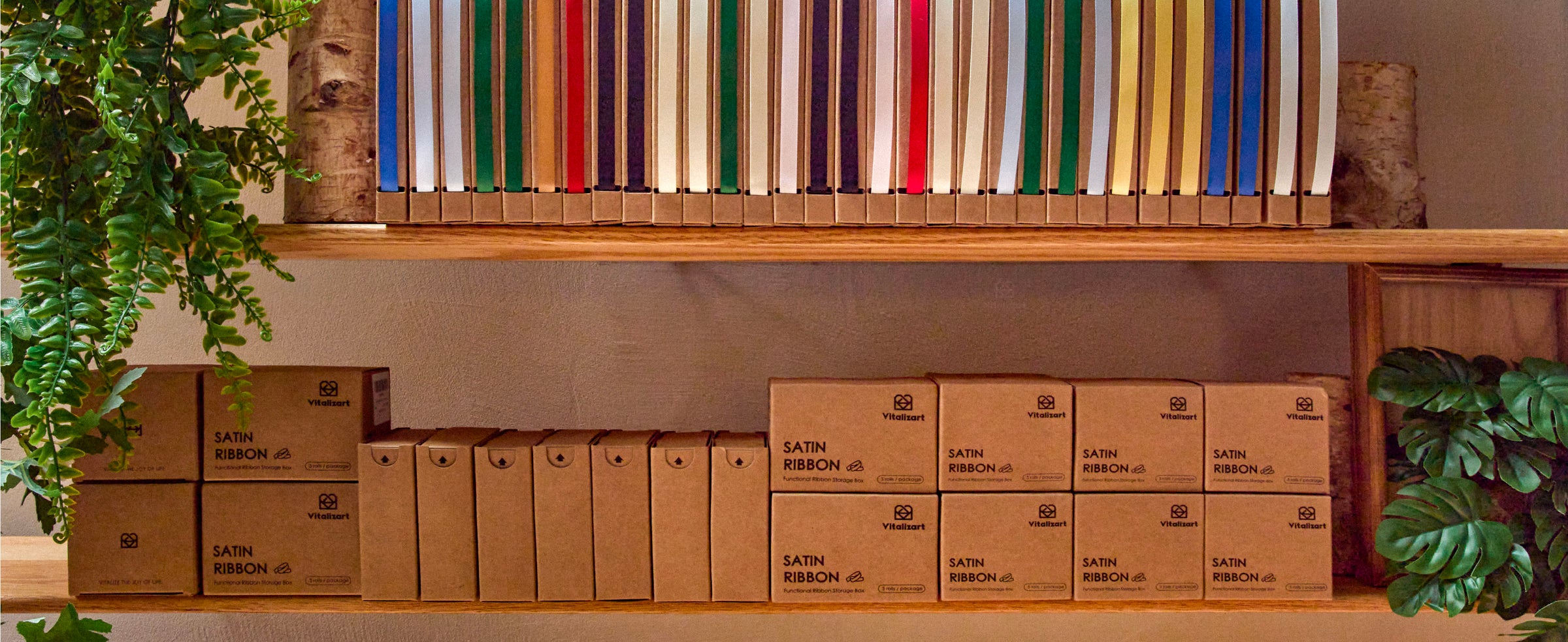 Boxed satin ribbons in assorted colors arranged upright on warm wooden retail shelves