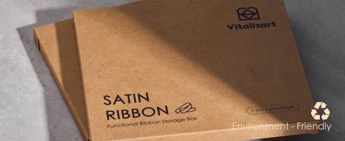 Boxed rolls from the pastel double-faced satin ribbon set shown with spools and package presentation