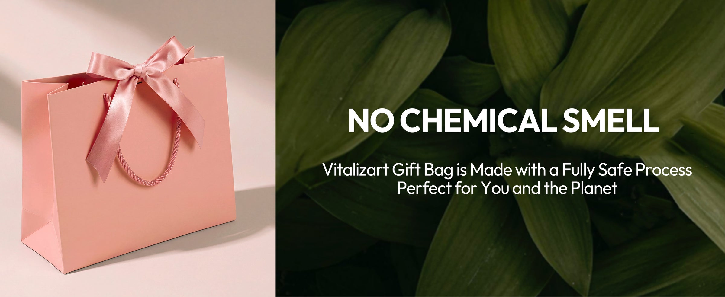 Blush-pink paper gift bag with twisted cord handles and a wide satin bow beside green leaves