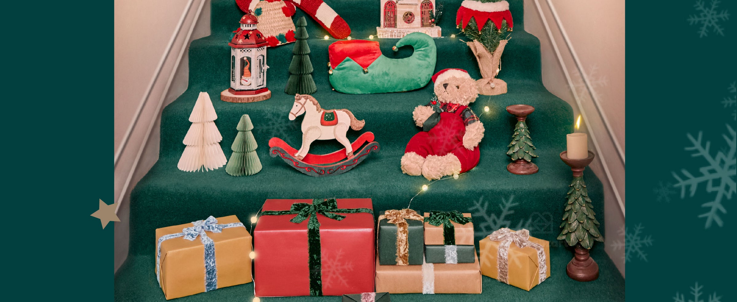 Christmas gifts tied with colorful plush ribbons arranged on green steps with warm lights