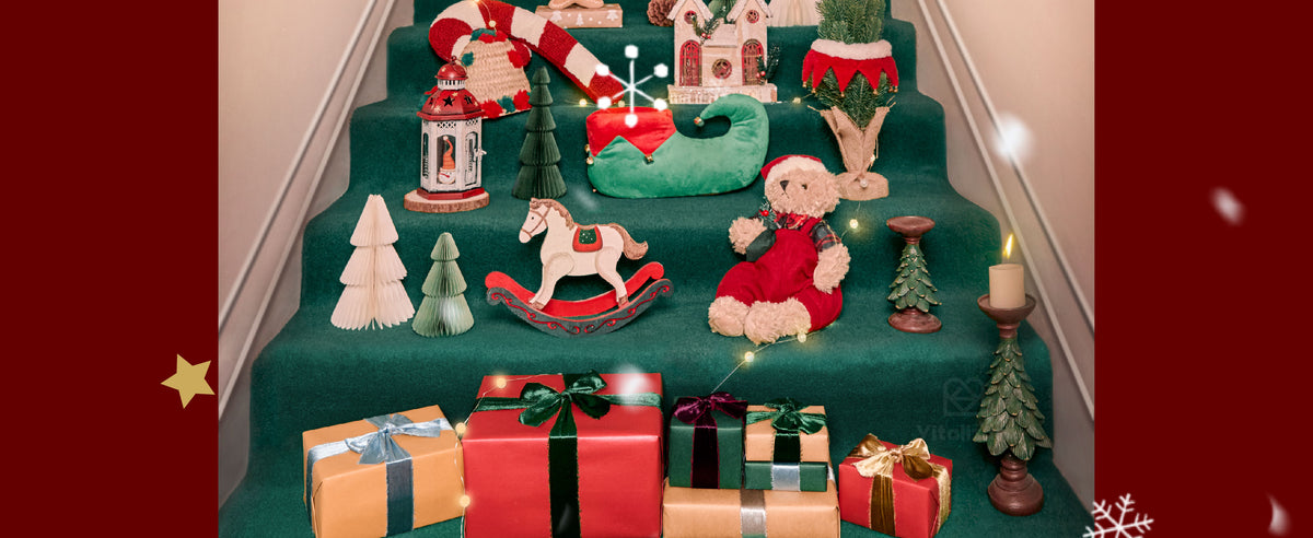 Holiday gifts tied with colorful velvet ribbons and bows arranged on deep green stairs.