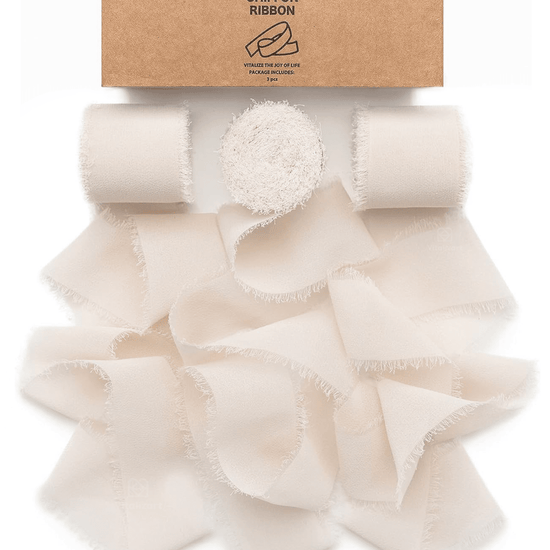 Light nude fringe chiffon ribbon roll on a white background