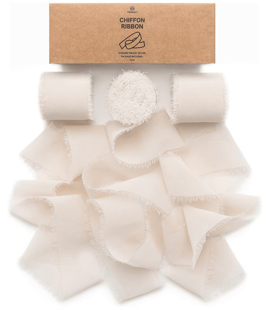 Light nude fringe chiffon ribbon roll on a white background
