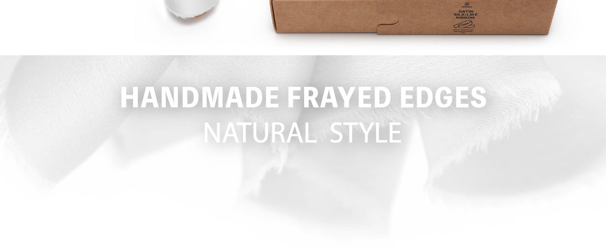 Close-up of white satin-like ribbon in soft overlapping folds with a subtle sheen and frayed edges