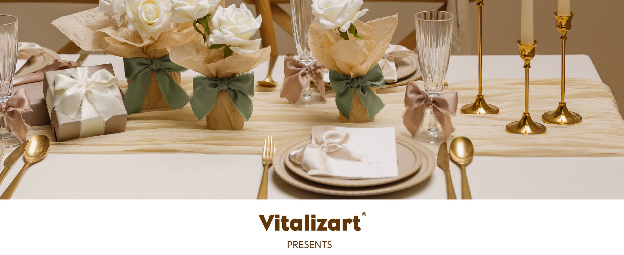 Dusty rose and green frayed ribbon bows decorate a candlelit formal table with white roses