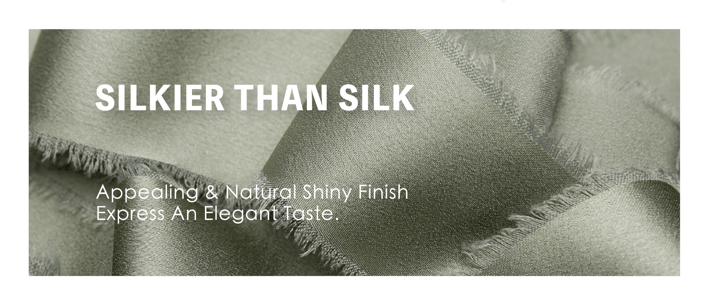 Dusty green frayed-edge satin ribbon tied in bows around a gift box and pale flower bouquet