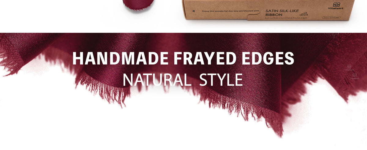 Close-up of burgundy satin-like ribbon with a glossy woven surface and softly frayed edges