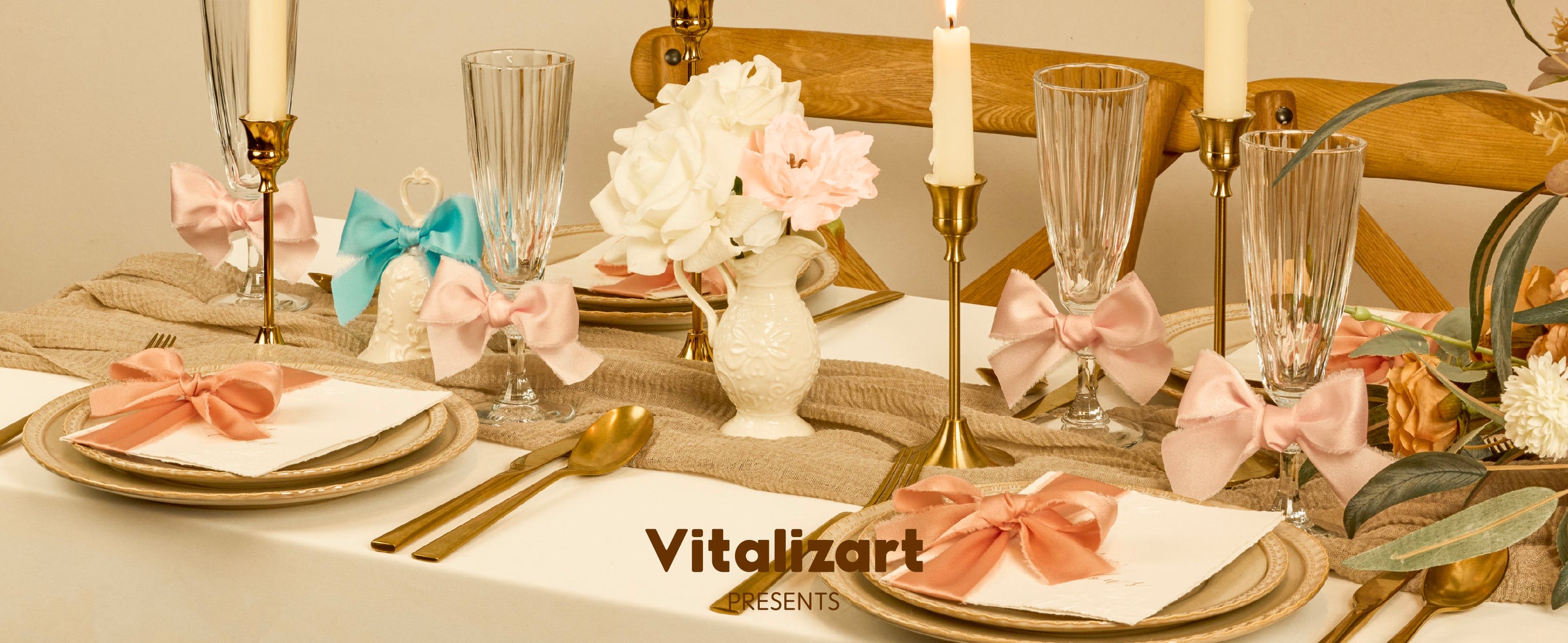 Pink, peach, and turquoise satin ribbon bows style a candlelit cream table setting