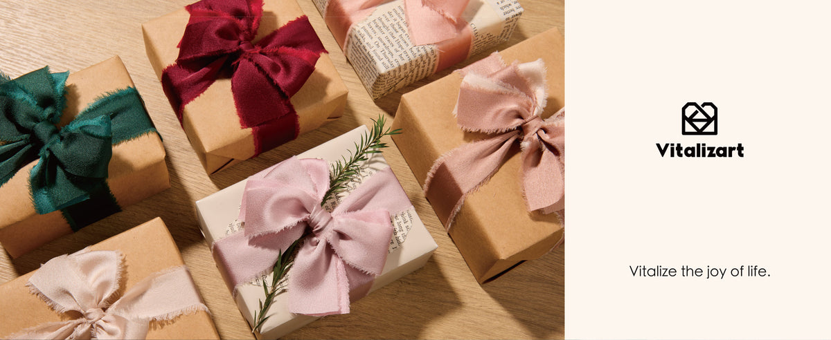 Wrapped gifts decorated with frayed satin ribbon bows in green, burgundy, blush, and pale pink.