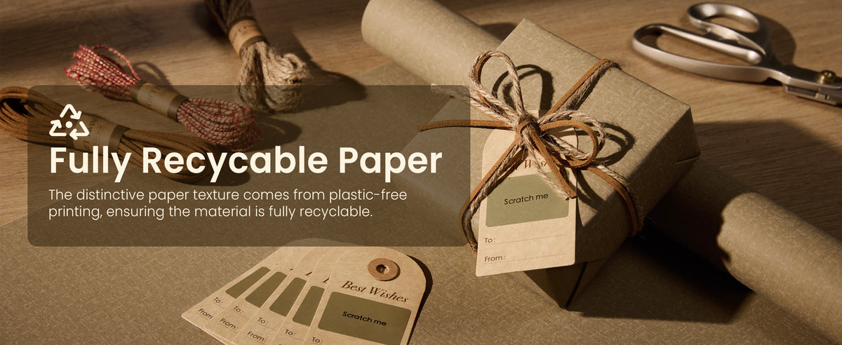Taupe-brown textured wrapping paper, twine, ribbon and kraft gift tags arranged on a worktable