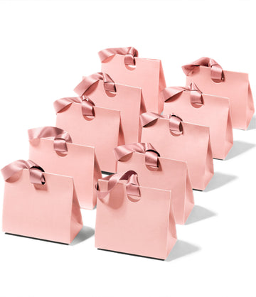 Mini pink paper gift bags with ribbon handles