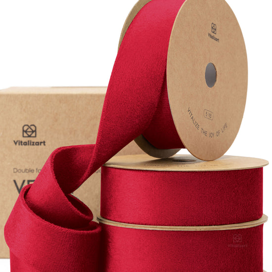 Red double-faced velvet ribbon on a spool