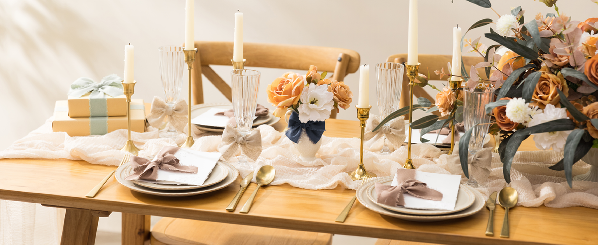 Brown cotton-linen ribbon woven through a bright dining table with flowers and candles