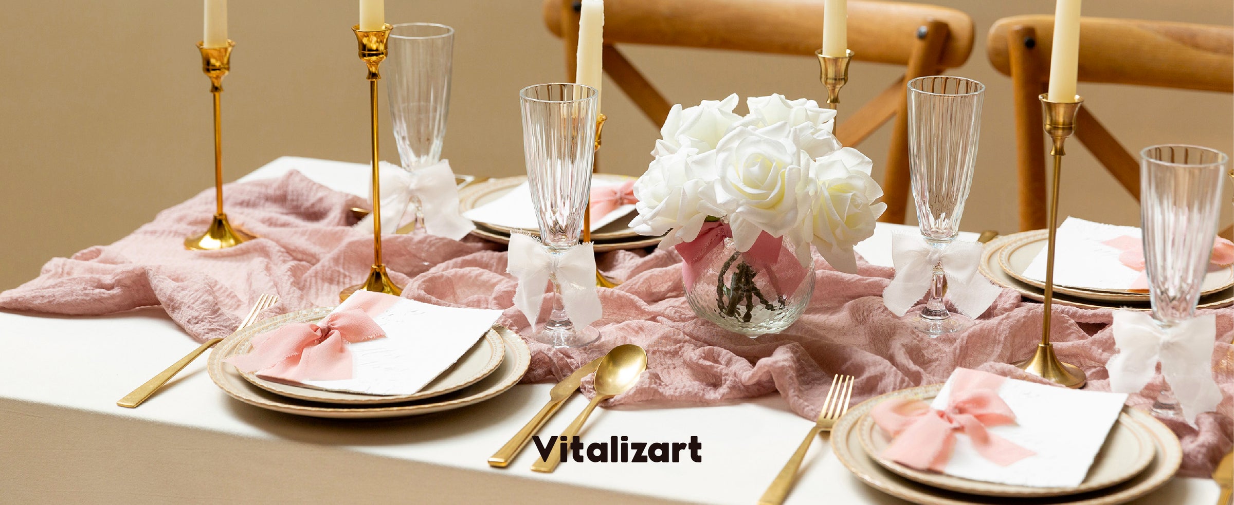 Pink and white chiffon bows decorate menus and glasses on a rose-and-gold formal tablescape.