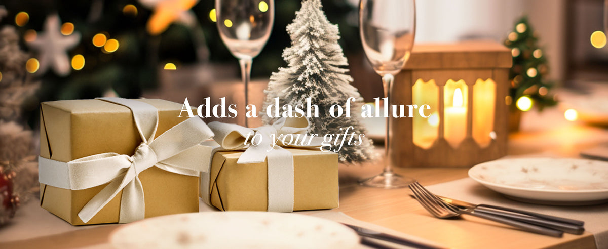 White velvet ribbon styled across gift wrapping, dining, and craft settings