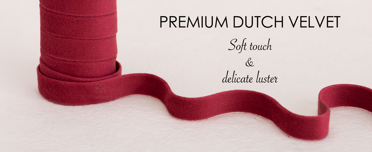 Close-up of burnt orange, camel, and taupe Dutch velvet showing its soft pile and delicate luster.