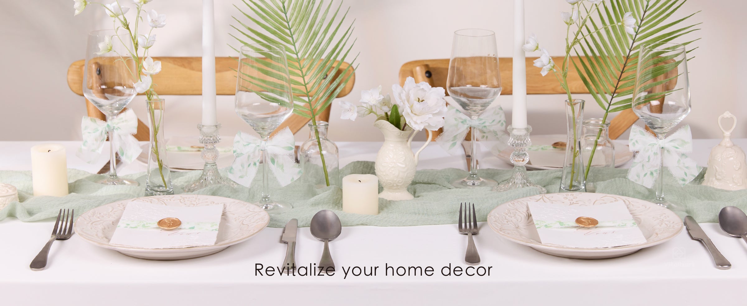Rolls of sheer white chiffon ribbon with green botanical prints and frayed edges