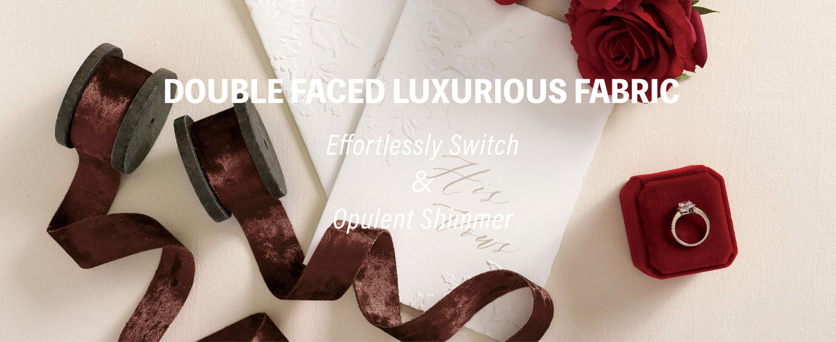 Double-faced dark brown crushed velvet ribbon beside red roses, an invitation, and a ring box.