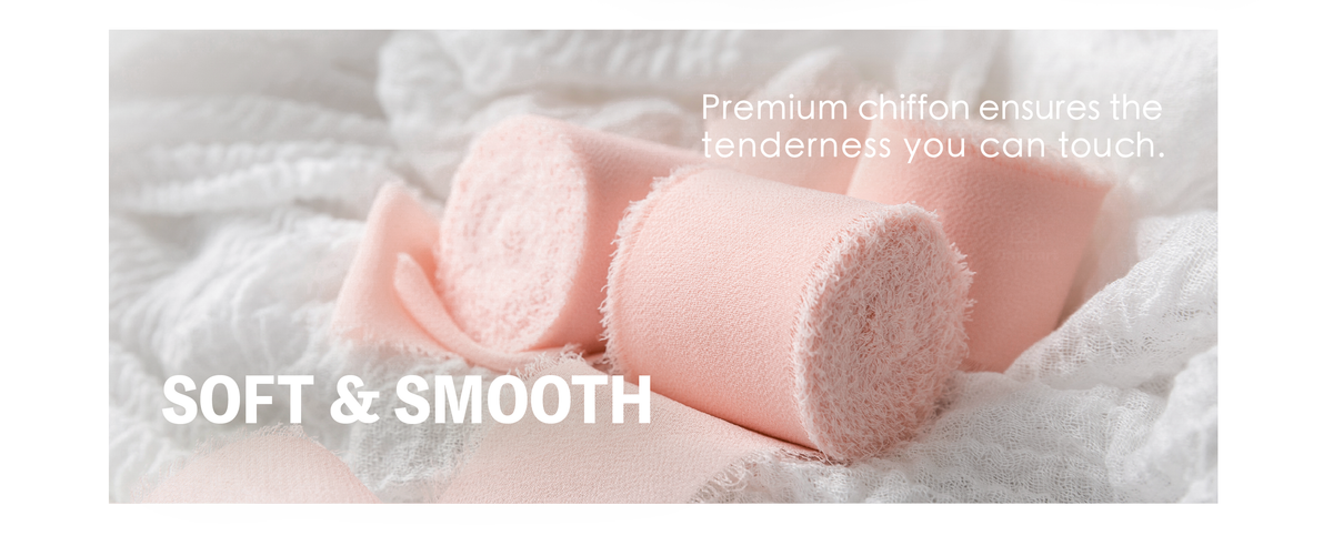 Soft light pink chiffon ribbon loosely curled over white fabric, showing its delicate fringed edges