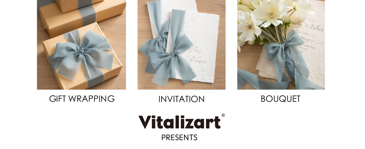 Dusty blue fringed chiffon ribbon decorating kraft gifts, white invitations, and a flower bouquet.