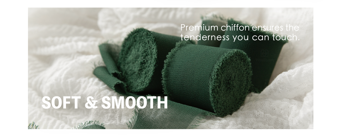 Dark green chiffon ribbon rolls with smooth woven surfaces and softly frayed edges on white fabric