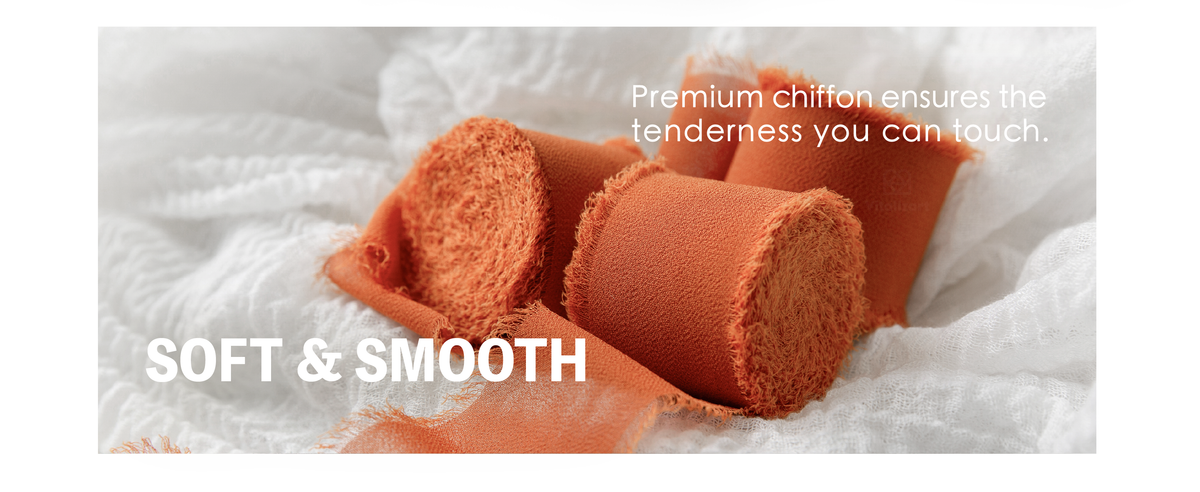Terracotta chiffon ribbon rolls with smooth woven surfaces and soft, visibly fringed edges on white fabric.