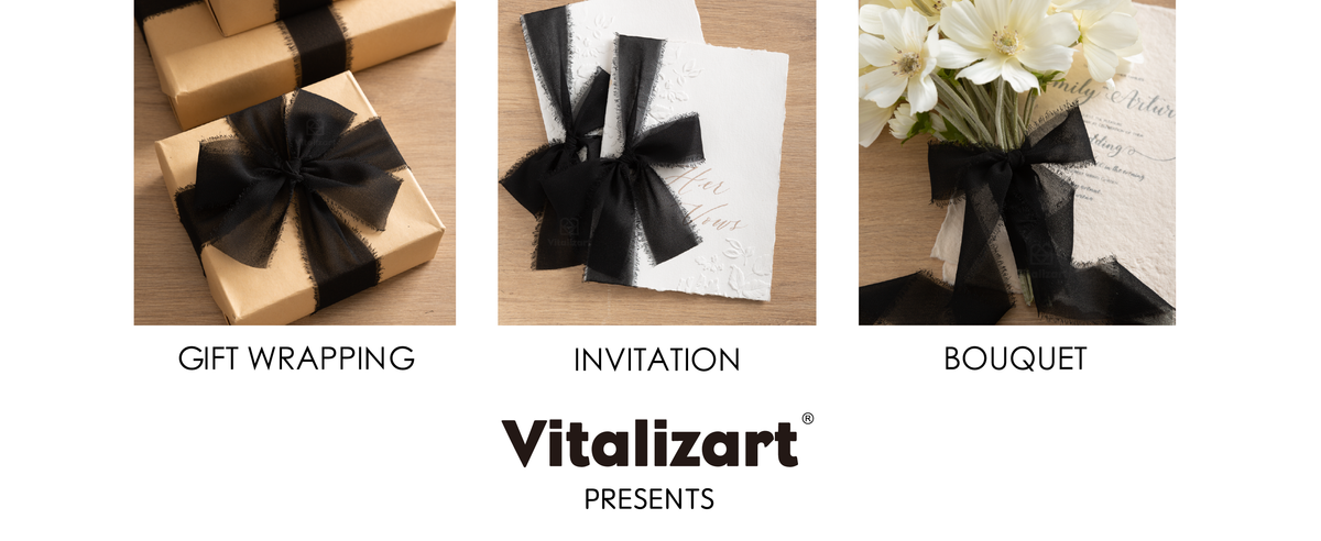 Black frayed-edge chiffon ribbon tied around kraft gifts, an invitation, and a white bouquet.