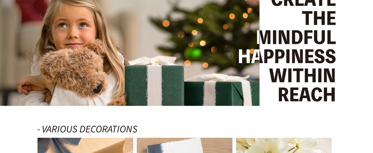 Girl hugging a plush dog beside a green gift wrapped with wide, frayed white ribbon.