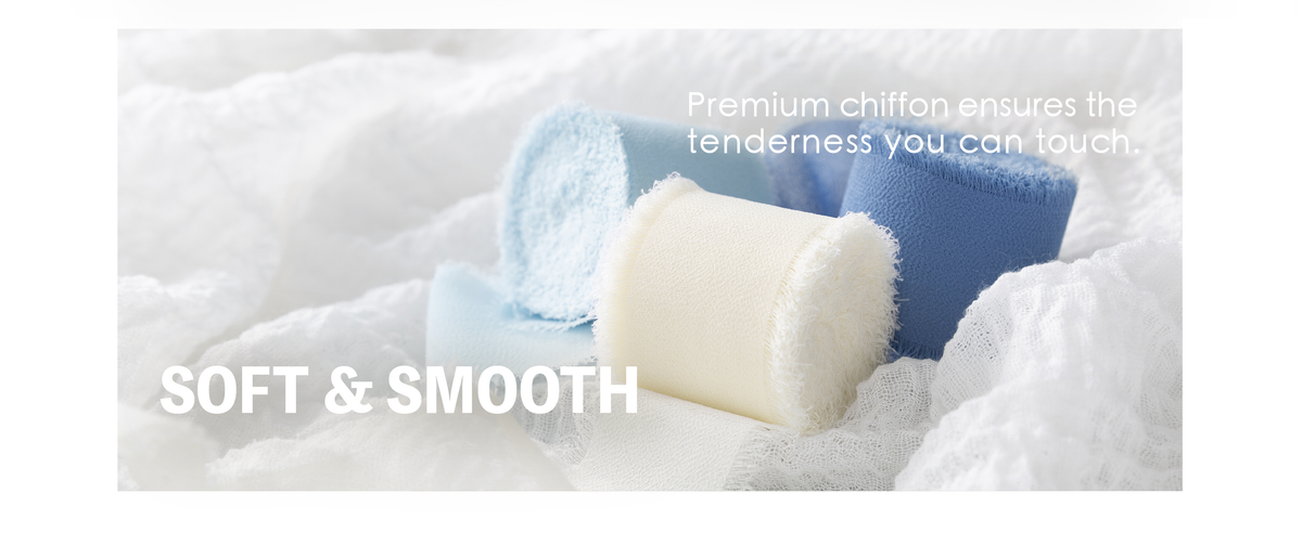 Soft pale blue, medium blue, and ivory chiffon ribbon rolls with feathery fringed edges.
