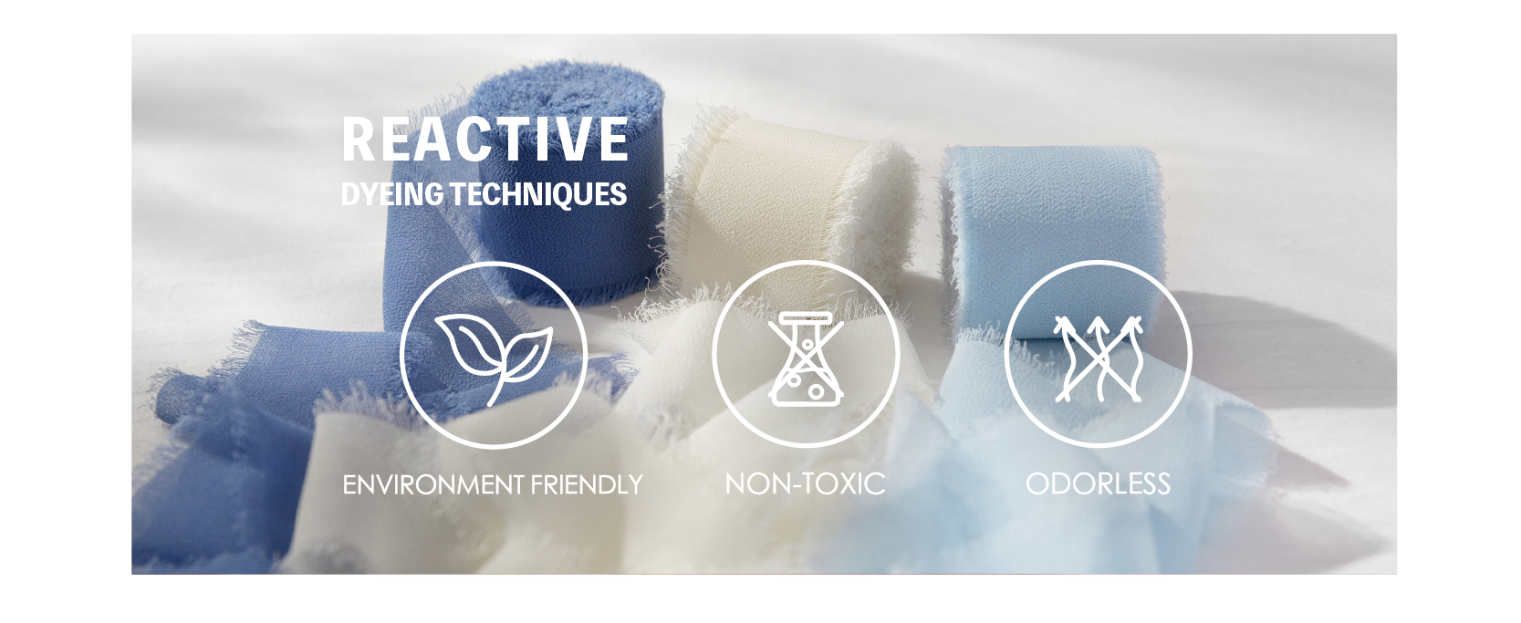 Blue and ivory fringed chiffon ribbons with icons for eco-friendly, non-toxic, and odorless dyeing.