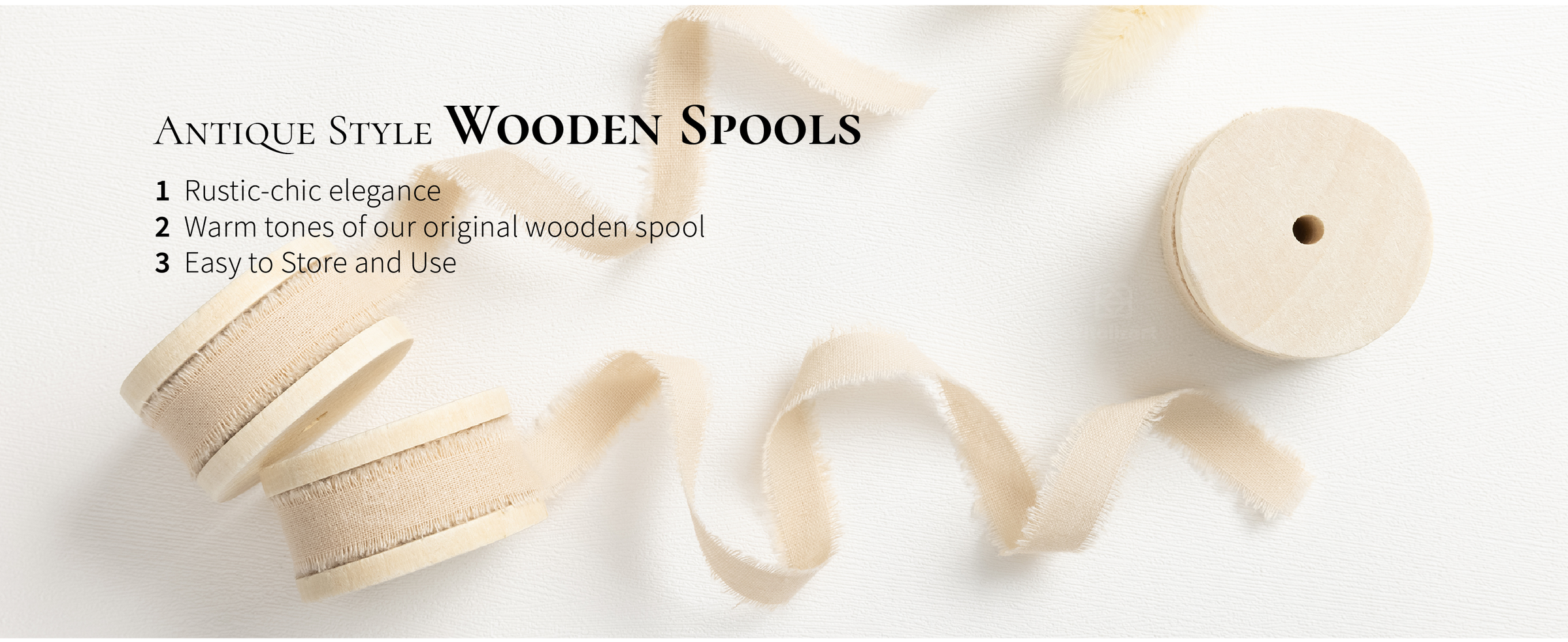 Light nude frayed cotton ribbon wound on pale wooden spools with loose ribbon trails