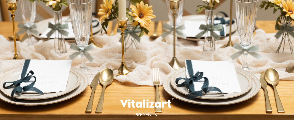 Sage and dark green frayed cotton ribbons decorate place settings on a candlelit dining table
