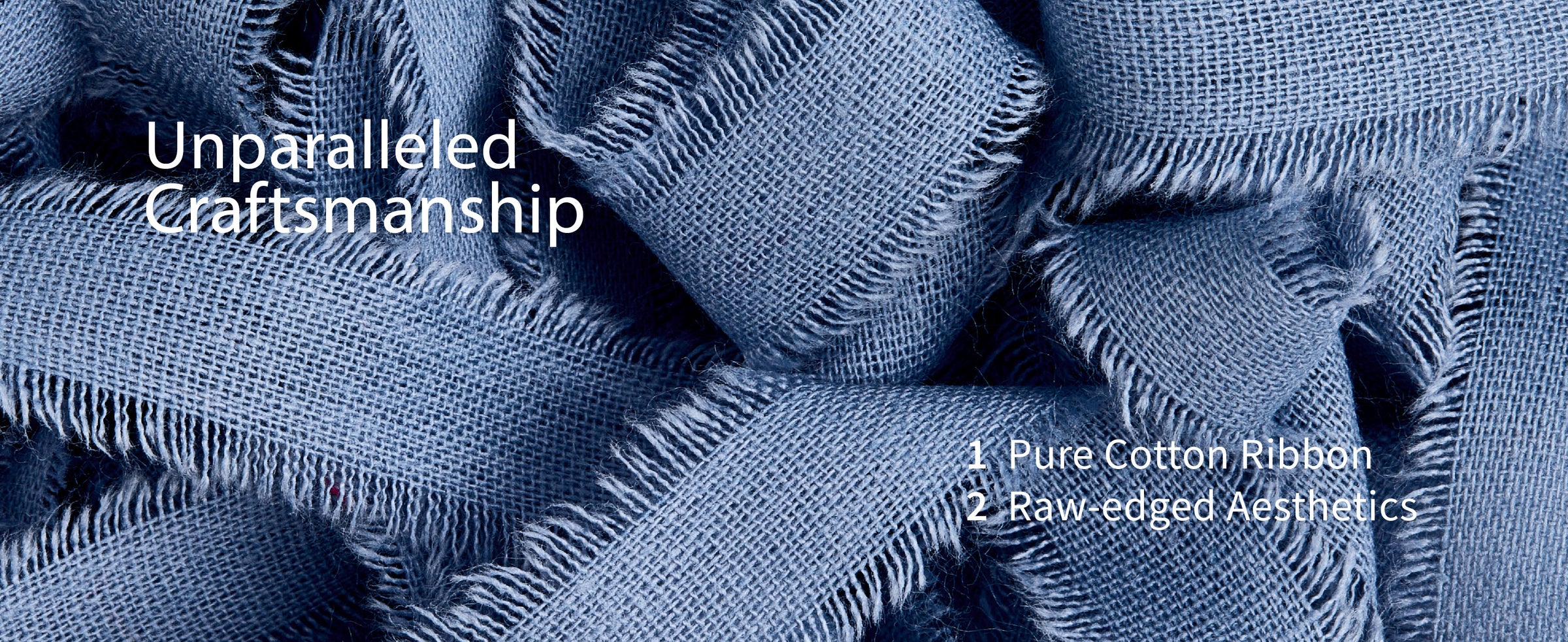 Close-up of blue pure cotton ribbon with an open weave and soft raw-fringed edges
