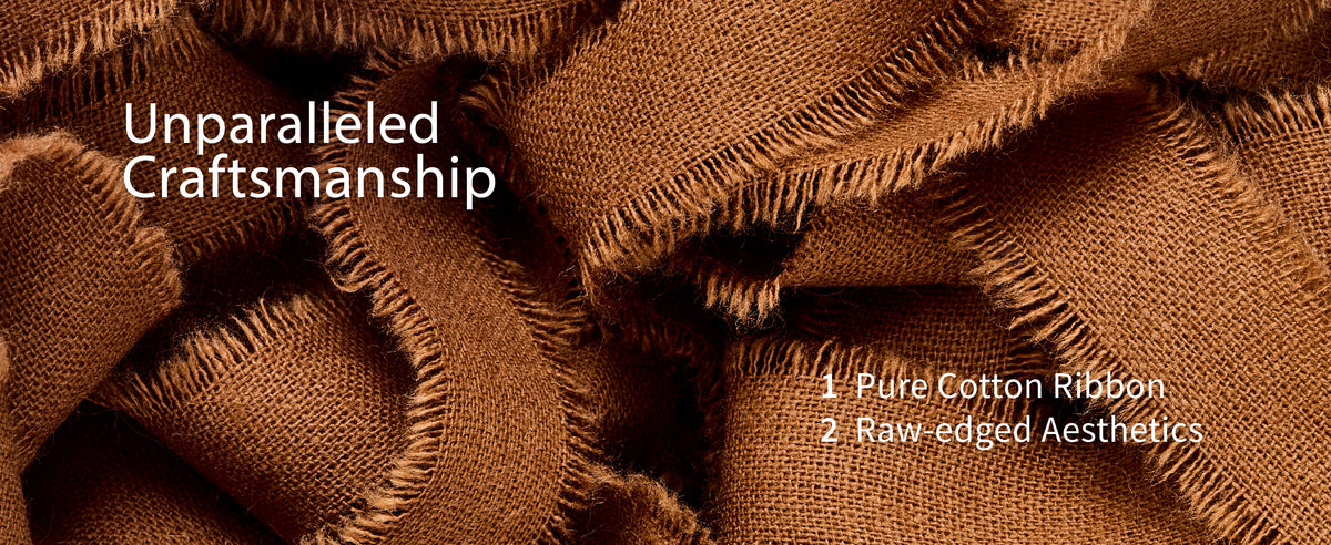 Close-up of warm brown cotton ribbon showing its coarse weave, soft folds, and raw fringed edges.