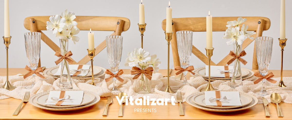 Brown fringed cotton ribbon accents vases, glasses, and place settings on a candlelit dining table.