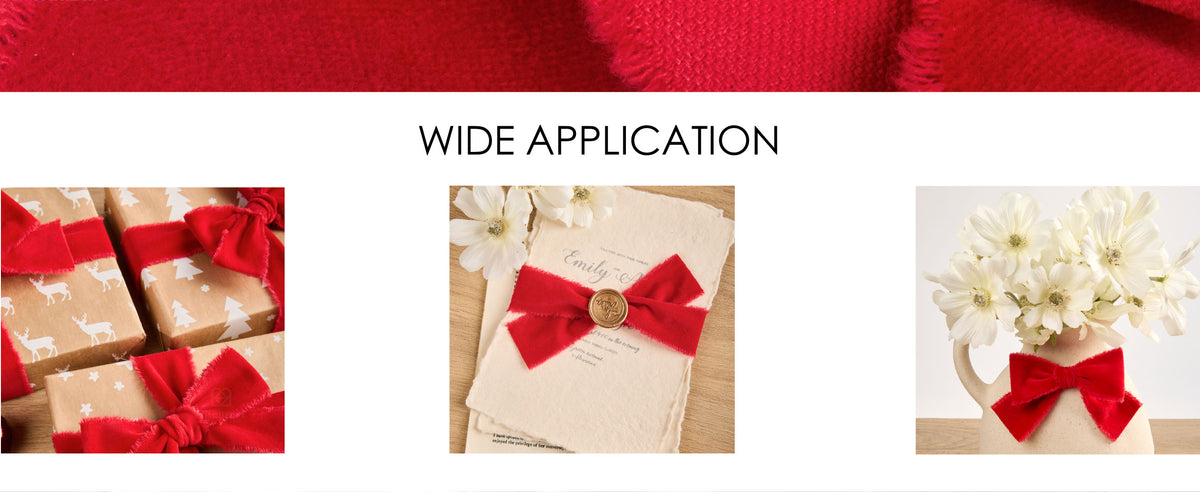Red fringed velvet ribbon tied on gift boxes, a wax-sealed invitation, and a flower pitcher