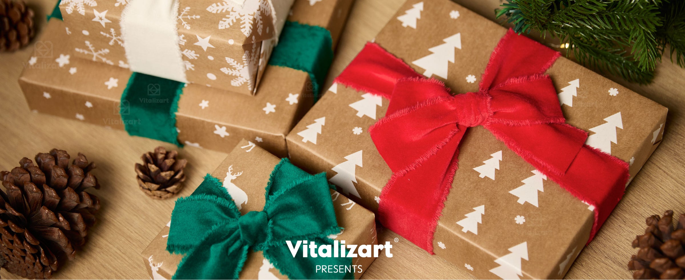 Christmas gifts wrapped with red, dark green, and white fringed velvet ribbon bows under a tree