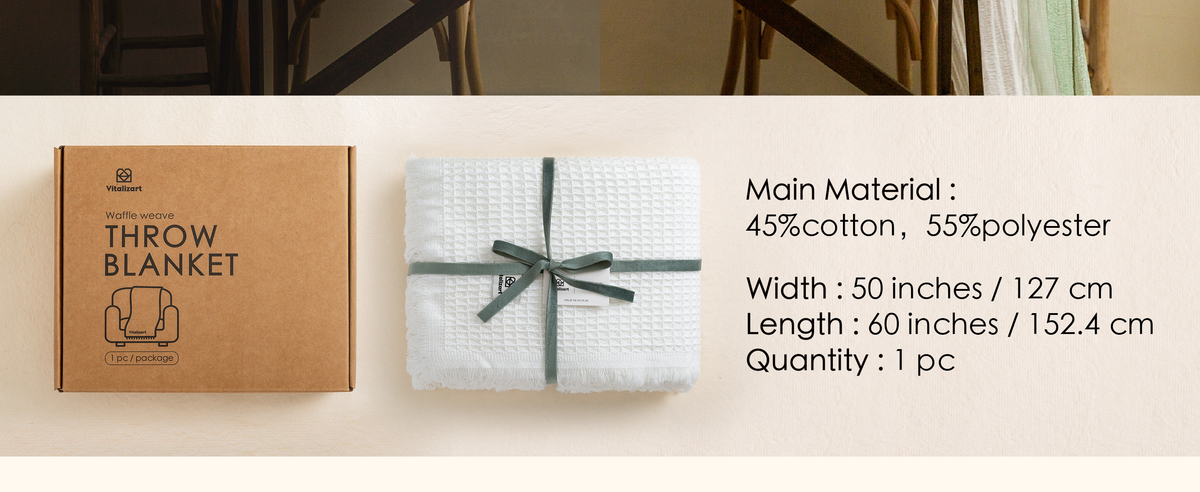 Folded white waffle-weave throw with fringe, packaging, and 50 by 60 inch specifications